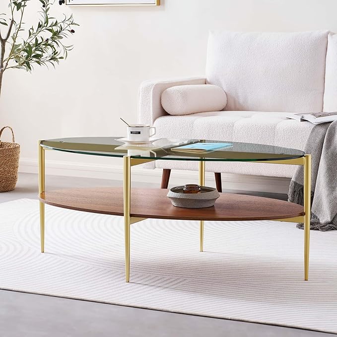 Oval Glass Coffee Table, Mid-Century Modern Design, L43 x W22 x H17 inch, 2-Tier Structure, Olive Shaped Clear Glass Top and Walnut Finish Wood Shelf, Tapered Legs with Gold Finish Frame