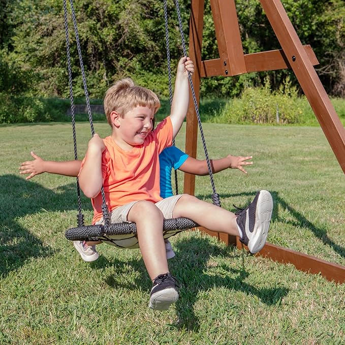 Backyard Discovery Skyfort All Cedar Swing Set, Elevated Covered Wood Roof Clubhouse with Bay Windows, 2 Belt Swings, Web Swing, 10ft Wave Slide, 5 ft Tube Slide, Covered Picnic Table, 5 ft Rock Wall